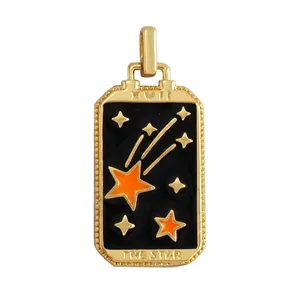 Detailed macro view of gold plated Tarot The Star pendant with black enamel and zircon