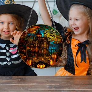 Halloween acrylic ornament with haunted house and pumpkin, held by kids with metal chain
