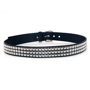 Detail of black leather belt with three rows of silver pyramid studs and metallic buckle