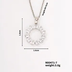 Detail view of silver sunburst pendant with square-cut cubic zirconia and chain dimensions