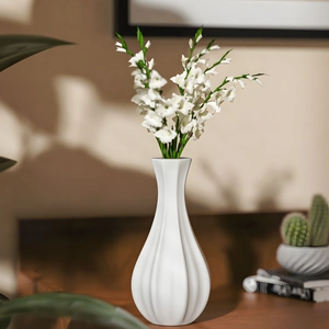 Macro view of white ceramic vase with sleek vertical textures and slender neck design