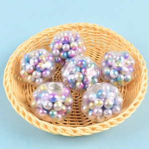 Detail view of six colorful decompression pearl squeeze balls in a woven bamboo basket