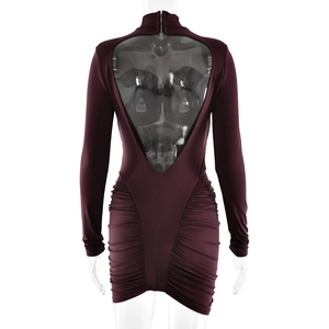 Detail view of burgundy ruched bodycon dress with an open back design and long sleeves
