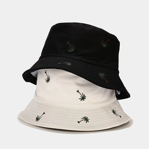 Unisex cotton bucket hat with green coconut tree embroidery in black and white colors