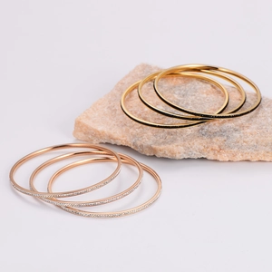 Bohemian 3-piece set of stacked stainless steel bangles with crystals and gold finish
