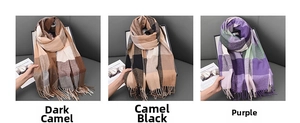 Close-up of classic checkered cashmere-like scarves with fringe in three stylish colors