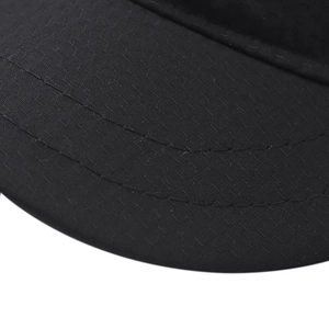 Close-up of double stitching and breathable mesh fabric on black outdoor cap