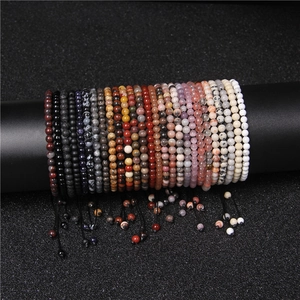 Multiple rows of adjustable 4mm natural stone yoga beads displayed on a jewelry stand