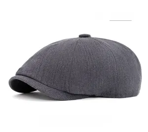Macro detail of cinerous herringbone newsboy cap showing premium wool texture and pattern