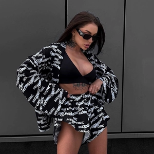 Close-up of three-piece lounge set with letter print and black camisole in street style