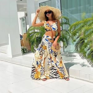 Two-piece floral crop top and maxi skirt set with ocean shell prints for beach vacation