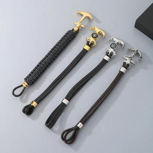 Detail of vintage Viking Thor hammer and anchor bracelets with integrated compass