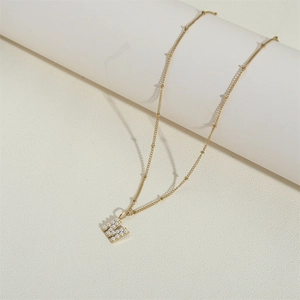 Retro stainless steel necklace with gold M letter pendant and pearl inlay for women