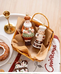 Christmas tree hanging decorations featuring chef Santa and Nutcracker in a woven basket
