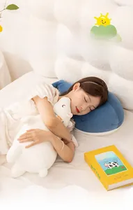 Cozy bedroom scene with girl hugging soft blue whale and white polar bear plush pillows