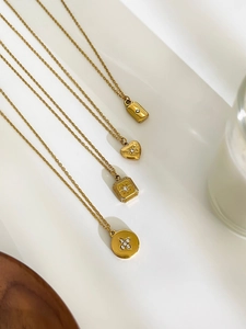 Set of minimalist gold stainless steel necklaces with geometric and heart pendants