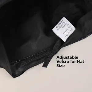 Detail of adjustable velcro strap and size label inside the cotton denim baker boy hat