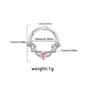 Detail of 1.2mm septum ring featuring pink heart gem and intricate flower vine design