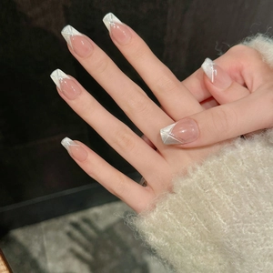 Detailed view of long square almond press-on nails with silver glitter French tips