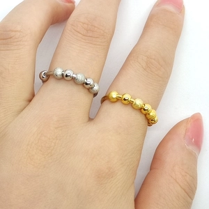 Adjustable stainless steel anxiety rings with rotating frosted and mirror beads in gold and silver