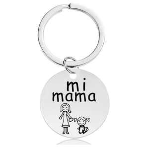 Macro detail of silver stainless steel keychain with mi mama engraving and mother-child icon