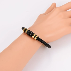 Bracelet minimaliste en cuir tressé noir avec perles cylindriques en métal or et noir