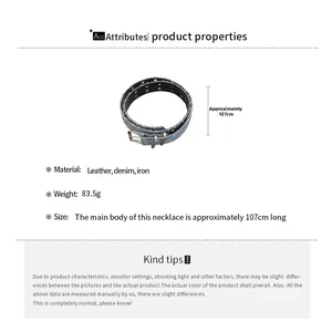 Detail of star cutout denim and leather belt with metal eyelets and product dimensions