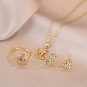 Parure bijoux dorés avec étoile et lune rotatives incluant collier bague et boucles