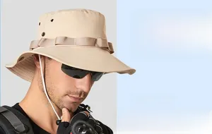 Detail of beige sun hat with wide brim, breathable metal eyelets and adjustable chin cord