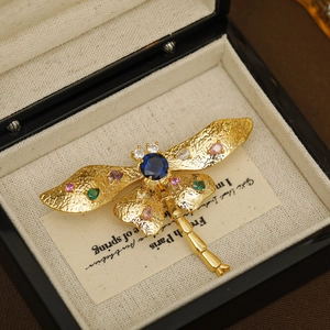 Golden dragonfly brooch with colored zircon and blue gemstone inlay in a premium gift box