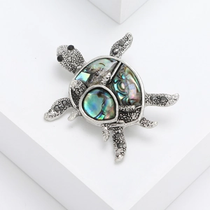 Vintage silver turtle brooch with colorful abalone shell inlay on white blocks