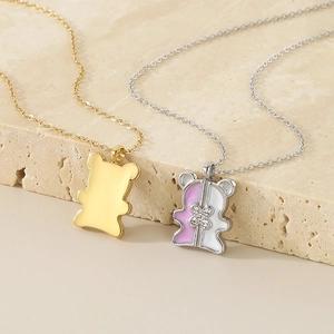 Minimalist stainless steel bear pendant necklace set in gold and pink enamel with crystal