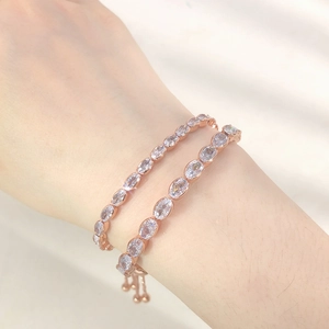 Detail of adjustable rose gold tennis bracelets with oval cubic zirconia and slide clasp