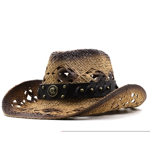 Detail of hand-woven straw cowboy hat featuring black leather band and vintage metal rivets