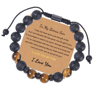 Detail of 10mm lava and tiger eye stone bead bracelet on a bonus son message card