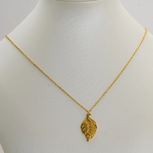 Minimalist gold-plated titanium steel necklace with elegant leaf-shaped pendant on a bust