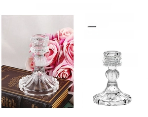 Macro detail of Nordic glass candle holder with elegant vintage embossed textured base