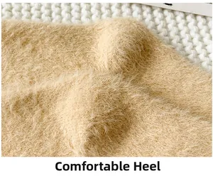 Macro shot of the plush mink fleece heel section on these warm beige floor socks