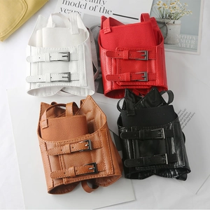 Miniature PU leather backpack charms in white, red, brown, and black with metal buckles