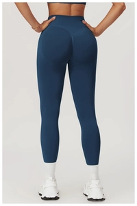 Detail view of high-waisted seamless scrunch butt yoga leggings in dark teal workout fabric