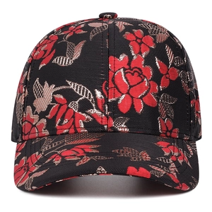 Ethnic style baseball cap with red and gold floral jacquard embroidery on black fabric