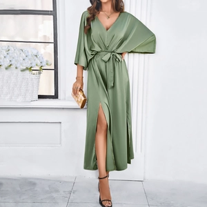 Elegant green v-neck maxi dress with waist tie and high side slit in satin fabric