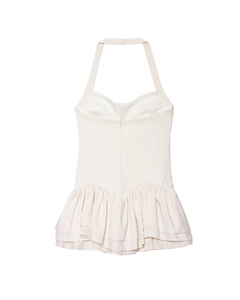 Detail view of double-layered ruffles on cream halter dress with seamless zip back