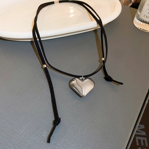 Y2K minimalist black leather choker featuring a 3D silver heart pendant and metal beads