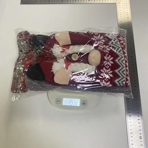 Detailed view of 3D Christmas couple faceless doll chair cover weighing 193.2g