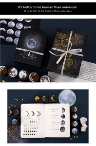 Close-up of vintage lunar phase wooden rubber stamps and cosmic themed gift box