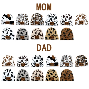 Cow pattern knit beanies with MOM and DAD leather patches in multiple colors