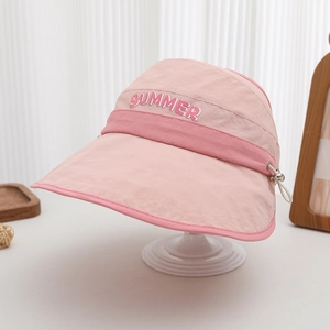Detail of pink sun hat with SUMMER patch and adjustable drawstring on white stand