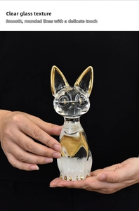 Macro view of crystal cat storm glass featuring hand-painted gold accents and polished finish