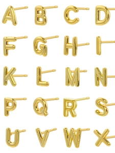 Selection of polished gold titanium steel earrings featuring A-Z alphabet designs
